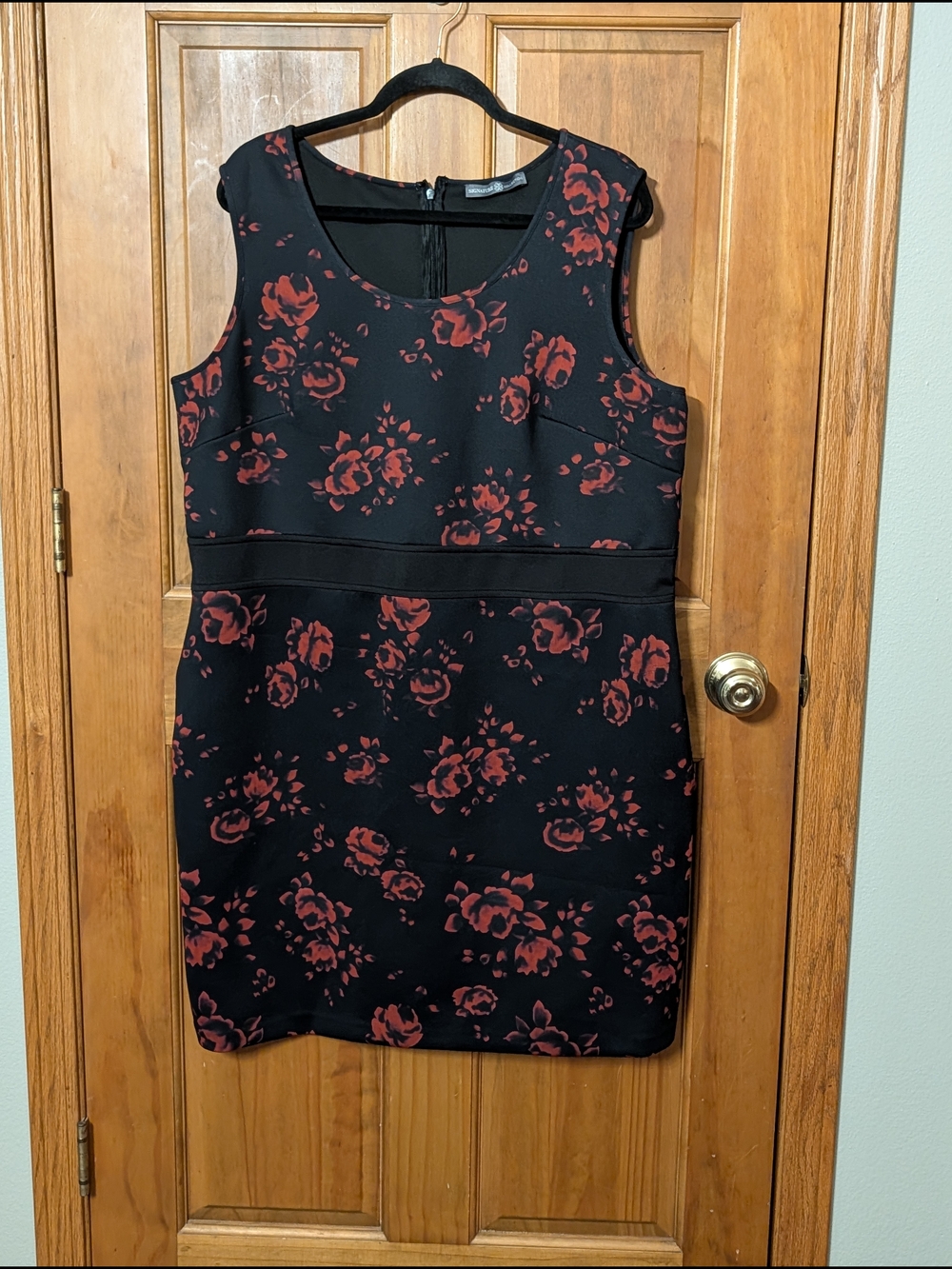 Sleeveless Black Mini Dress with Red Floral Pattern